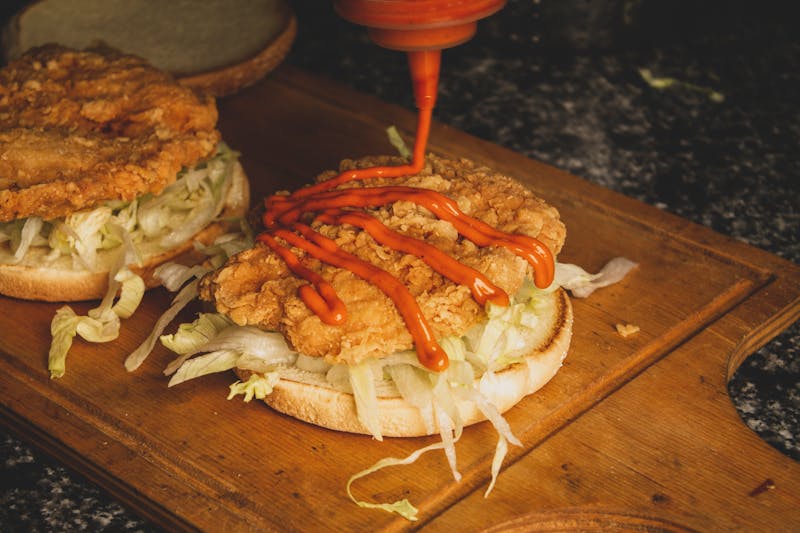 Classic crispy chicken sandwich with lettuce and pickles on brioche bun