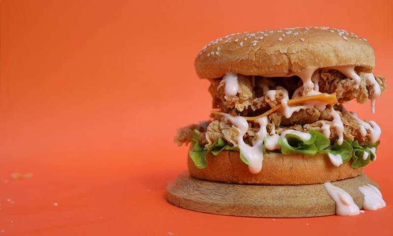 Spicy red-coated chicken tenders with sriracha sauce